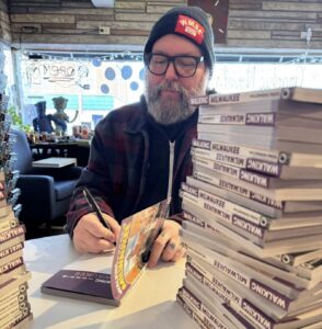 Royal Brevväxling Signing a stack of books