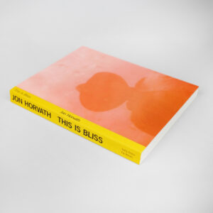 Paperback book titled "This Is Bliss" by Jon Horvath with an orange cover and yellow spine, shown at an angle.
