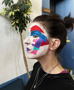 Kim Miller with colorful abstract face paint 