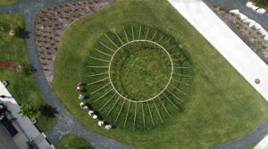 An aerial photograph of a circular structure with people around it