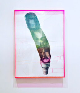 A splash of color coming from a flashlight beam revealing photos.