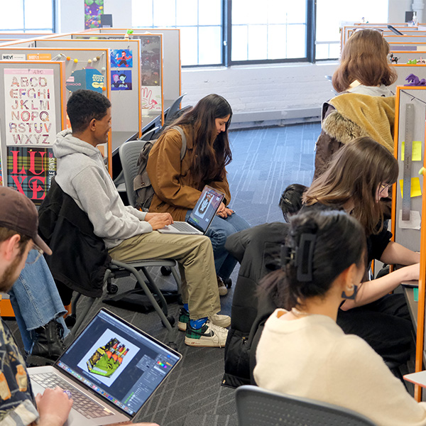 A group of CD students works in studios on the fourth floor.