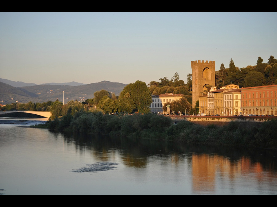 23Florence 15 A picture of a pond and old castle structure in Florence, Italy
