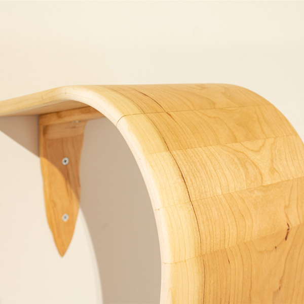 A detail of a wooden waterfall sculpture