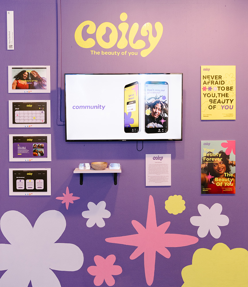 A purple wall painted with stars and clouds, with a TV and images from the website Coily