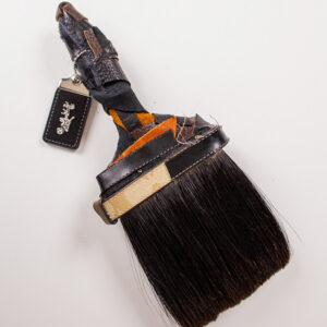 A detail of a crocheted brown shoe