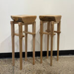 Two handcrafted wooden stools