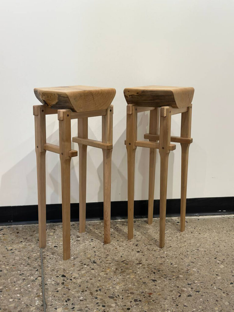 Two handcrafted wooden stools