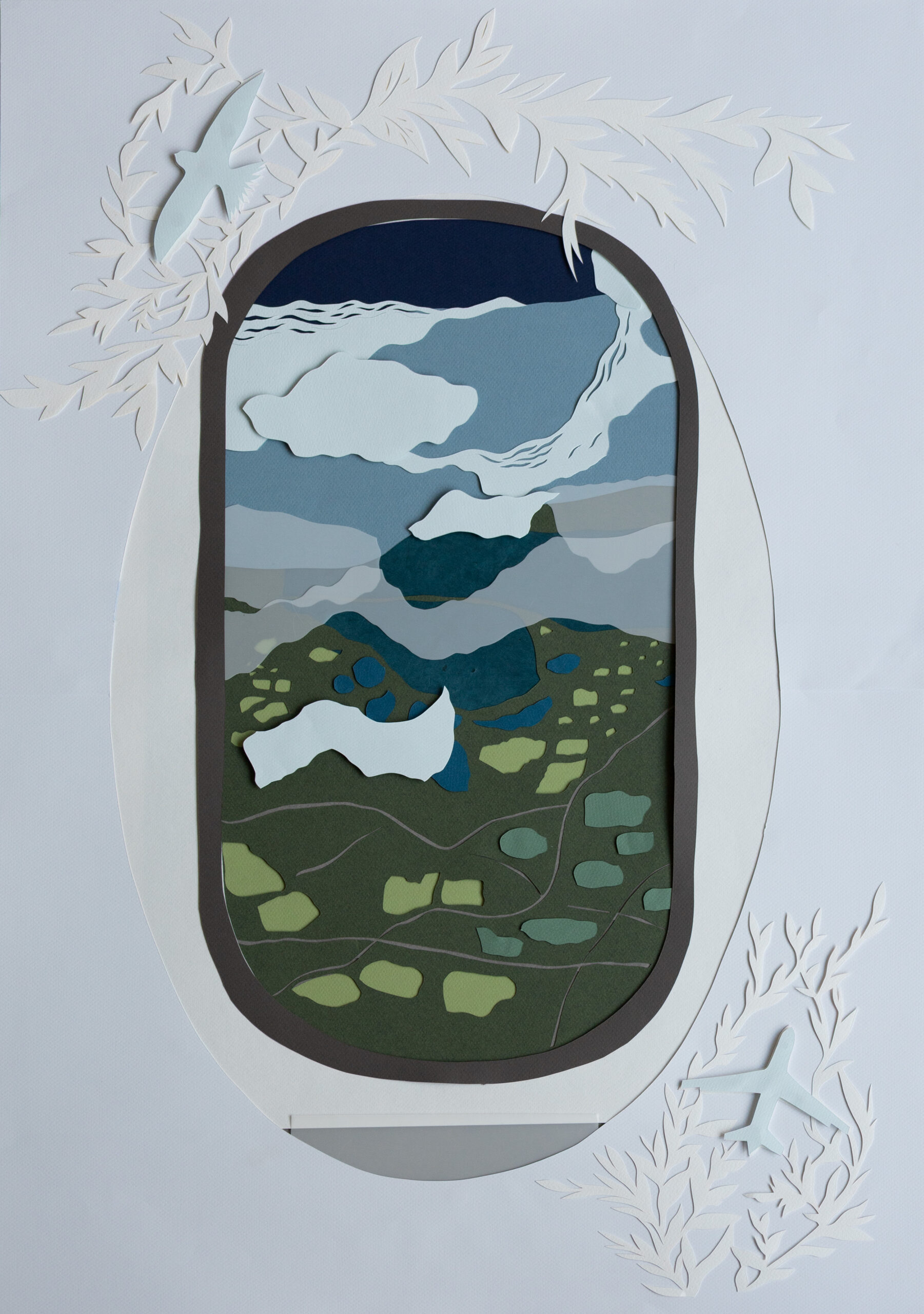 _MG_1340-1 Layered paper-cut artwork depicting an airplane window view of a landscape below. Through the oval window, fields, lakes, clouds, and layered landforms are visible, while paper-cut airplane silhouettes and foliage-like shapes frame the composition.